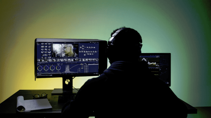 A man sitting in front of the computer / video formats